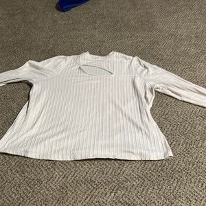 Cream colored, 2xl shirt with a slit in the front